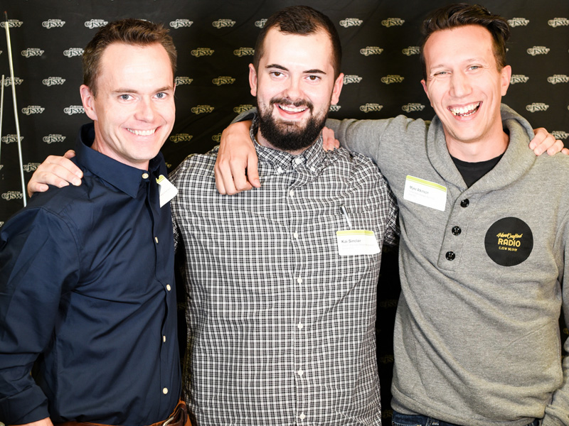 Three generations of station managers, (left to right) Chad Saunders, Kai Sinclair, and Myke Atkinson celebrate the launch of We Make Radio: 30-Something Years of CJSW | Photo: Michael Grondin, courtesy of CJSW