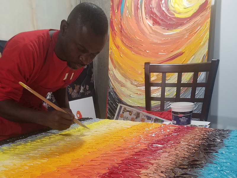 Lanre Ajayi paints a bright and colourful canvas