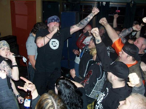 Punk act BDFM perform in a tight crowd