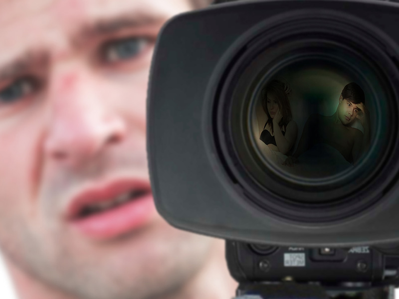 A photo of a guy behind a video camera