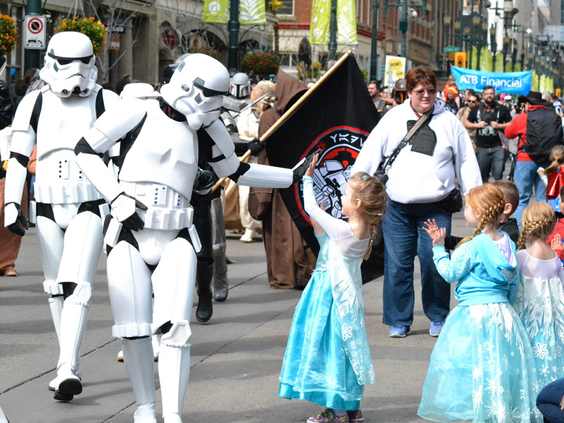 Three Elsas high five a group of storm troopers