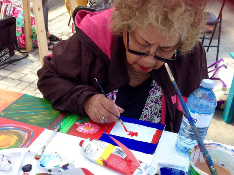 Photo of a participant making an artist trading cards