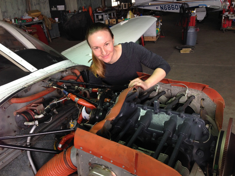 Lucier performs maintenance on her Piper Archer