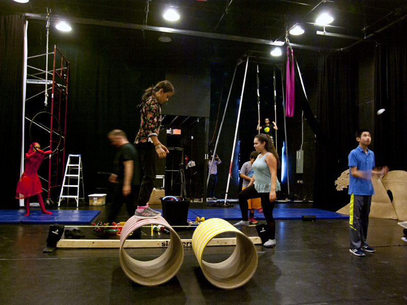 Participants of a special Social Circus Camp rehearse at the West Village Theatre