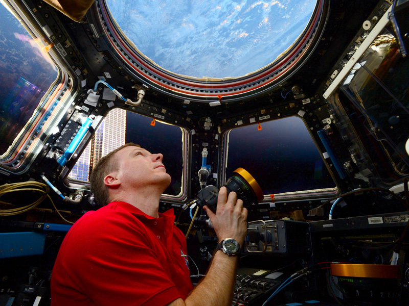 Terry Virts with his camera in the International Space Station