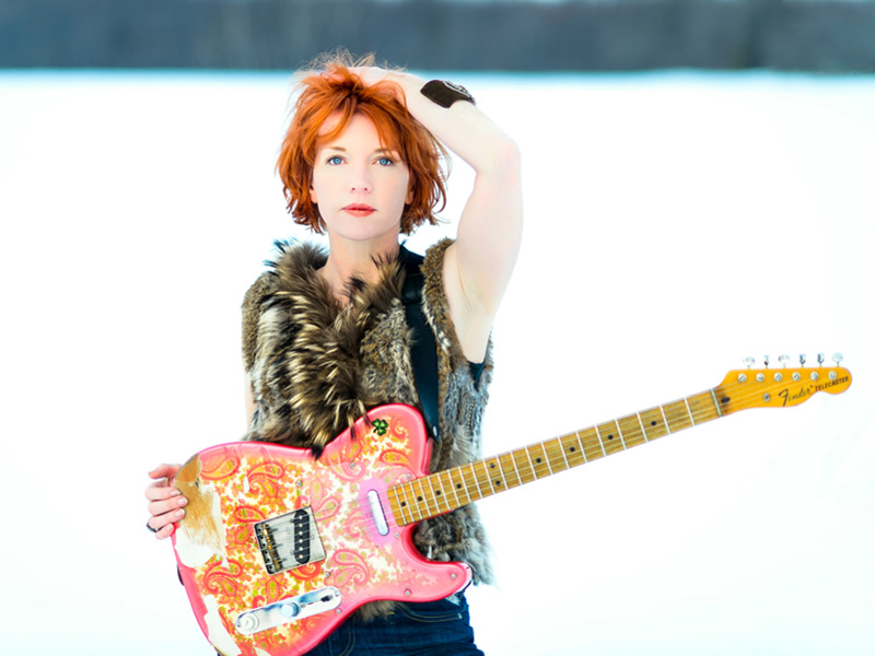 Photo of Sue Foley and her guitar