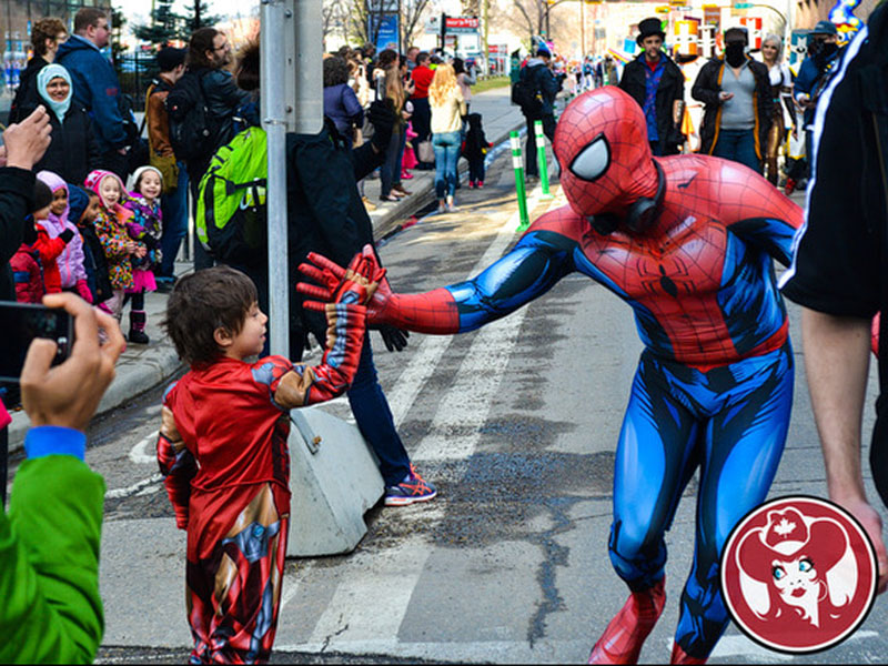 Spiderman gives a young Iron Man a high five