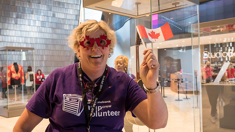 A volunteer greets visitors to Studio Bell, home of the National Music Centre
