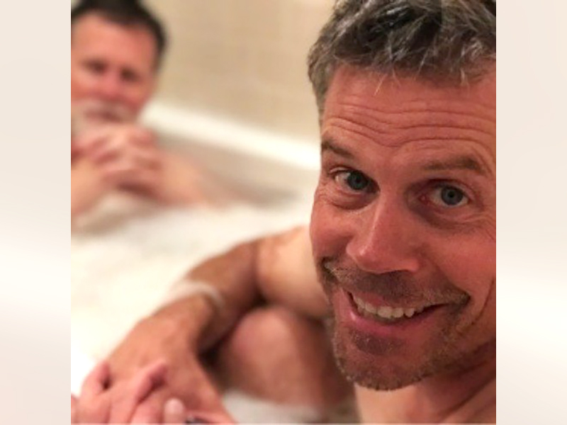 Photo of Jim Button and Dave Kelly in a bubble bath