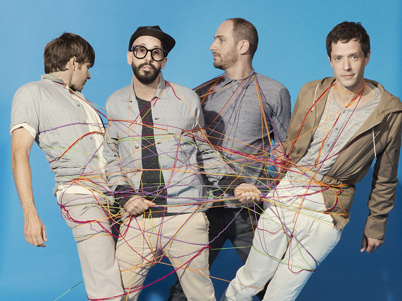 A promo photo for OK Go - The Live Video Tour