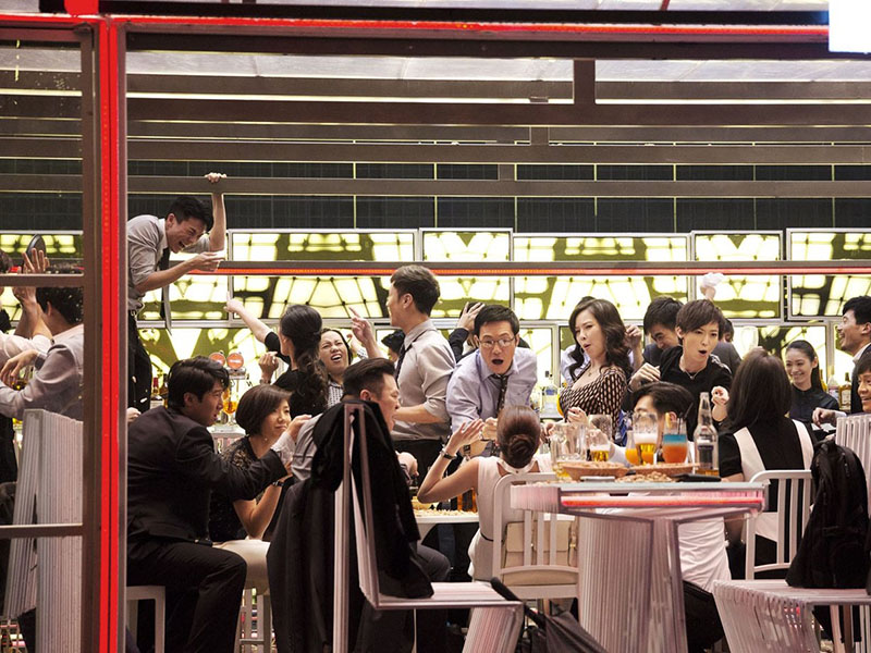 A still from Johnnie To’s Office of a party in a restaurant