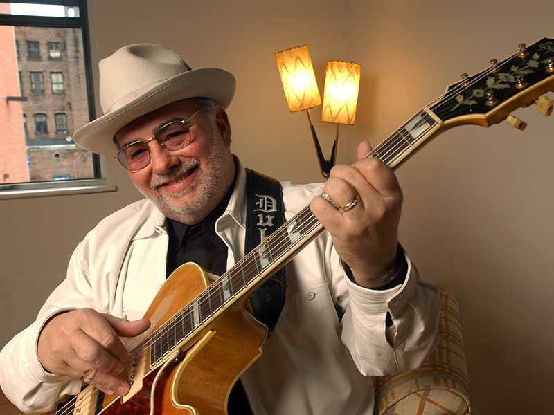Duke Robillard holds his guitar