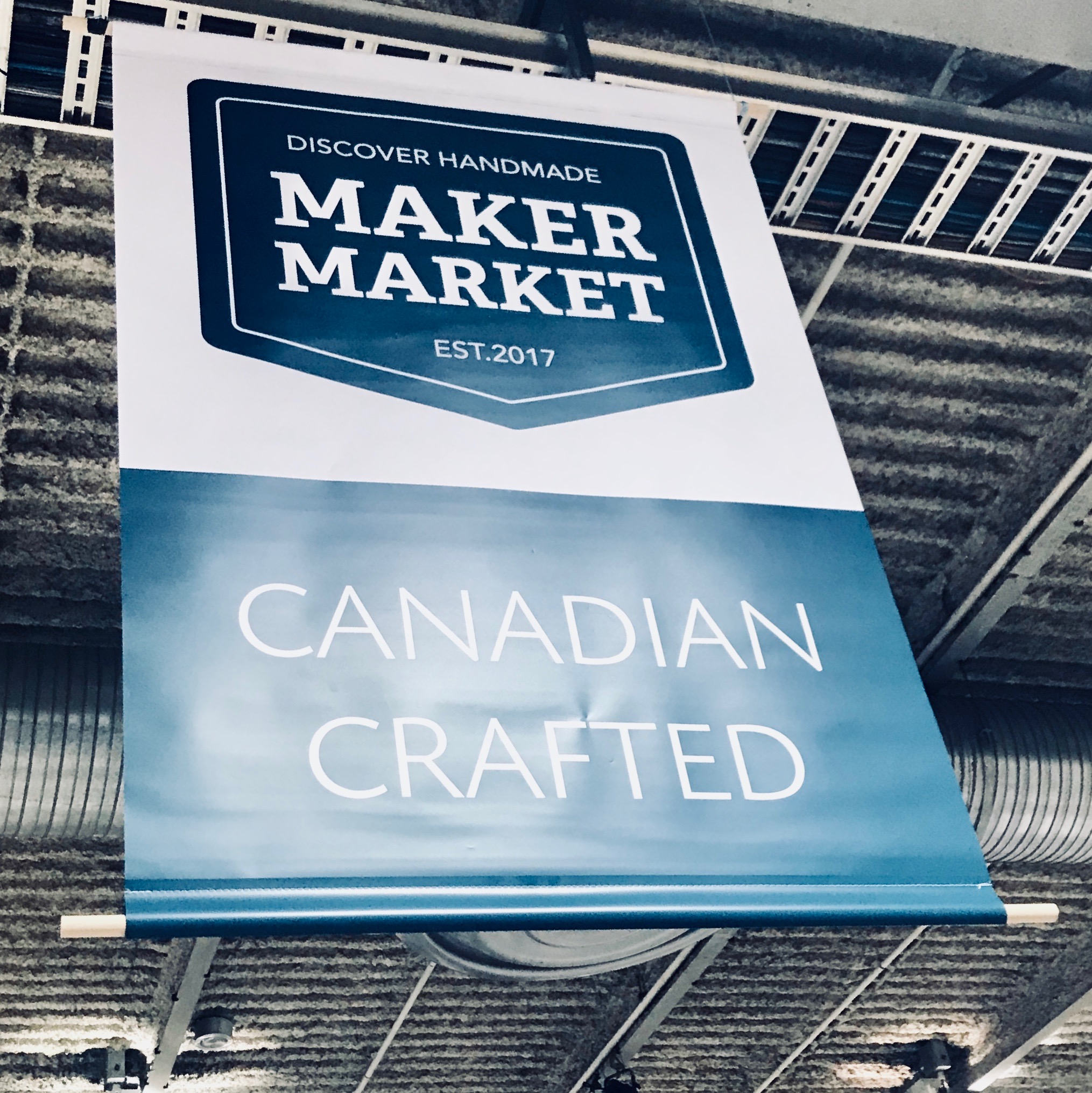The banner for the Maker Market hangs in the BMO Centre