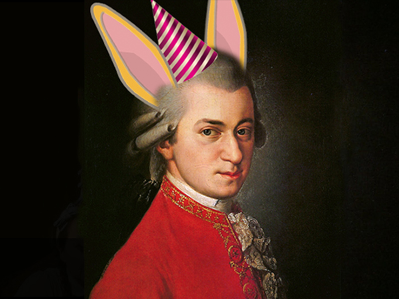 A portrait of Wolfgang Amadeus Mozart with a digital party hat and rabbit ears added
