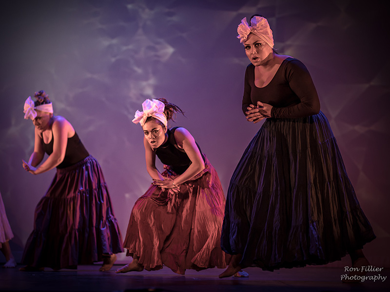 Dancers perform on stage in Unganisha