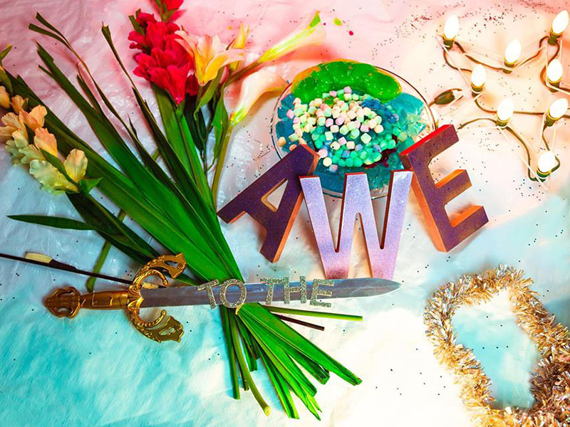 A bright still life with to the AWE spelled out in colourful letters