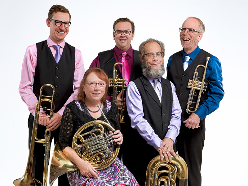 A photo of Foothills Brass Quintet members with their instruments
