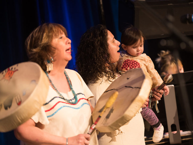 Olivia Tailfeathers and the Grassland Singers on stage at the 2019 Mayor's Lunch for Arts Champions