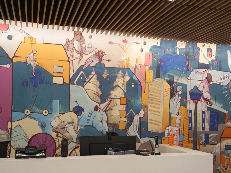 Image of Calgary mural painted behind an office desk by Mary Haasdyk