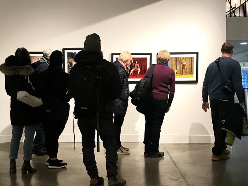 People explore an exhibit at the Exposure Photography Festival