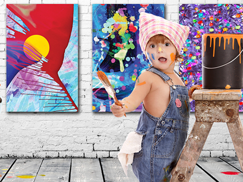 A stock photo of a toddler painting