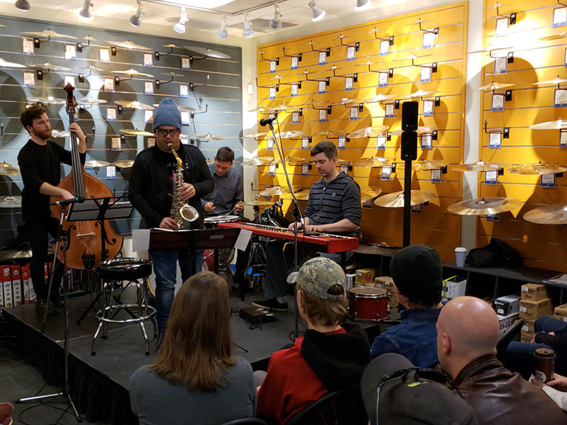 Jazz musicians perform in a music shop