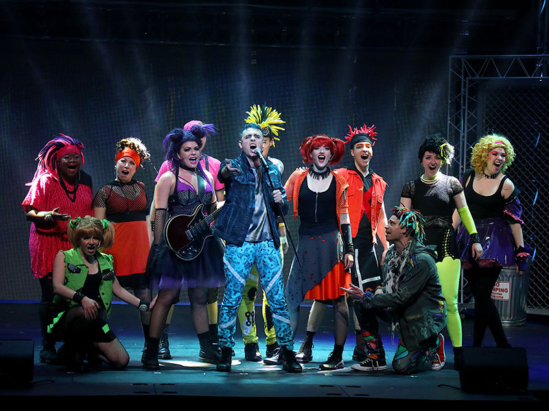 We Will Rock You features a cyberpunk world