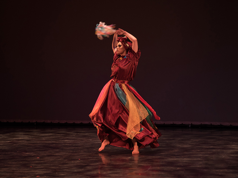A dancer on stage in Unganisha