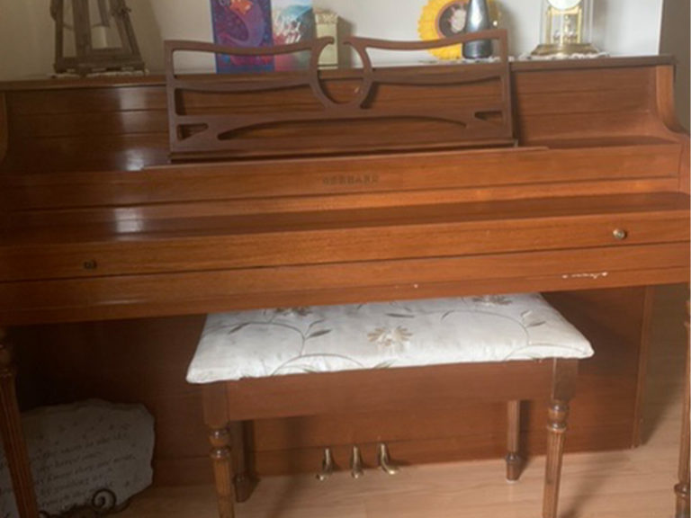 A photo of an upright piano