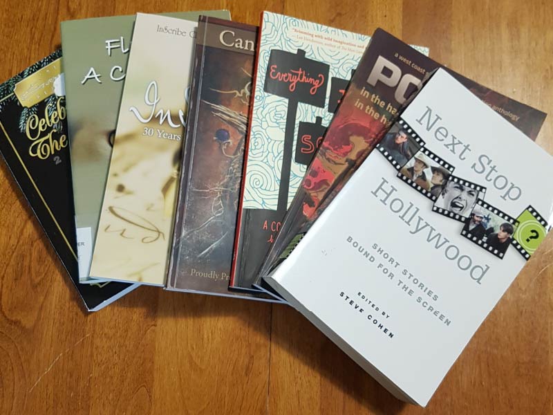 A photo of various books fanned out across table