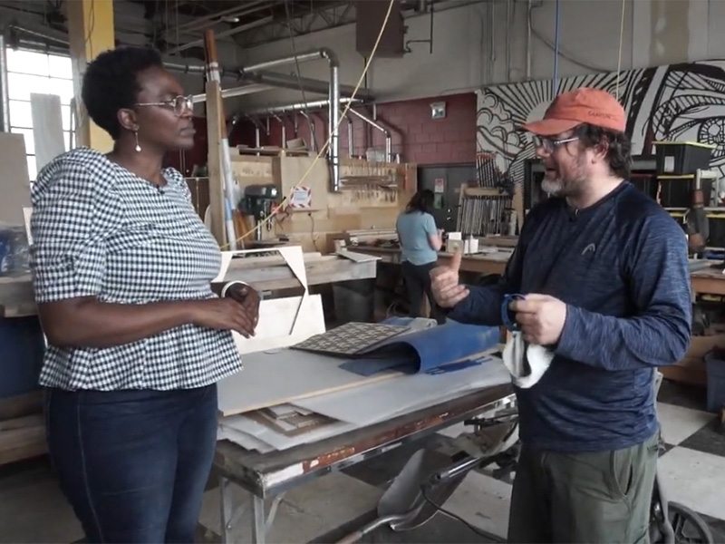 A screen cap from the Living a Creative Life web series of Adora Nwofor and Shannon Hoover at Fuse33 Makerspace