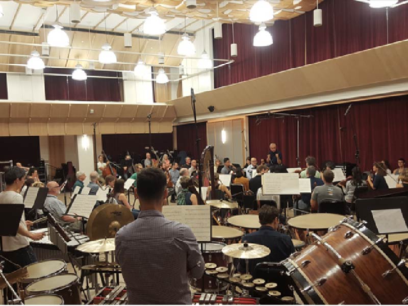 A photo of a rehearsal taking place at the Jack Singer Rehearsal Hall