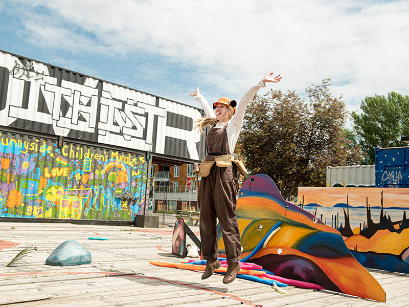 An actor plays Bev the Builder at containR outside