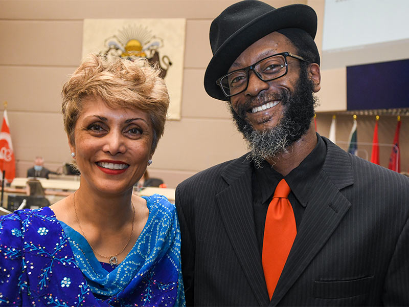 A photo of Poet Laureate Wakefield Brewster with Mayor Jyoti Gondek