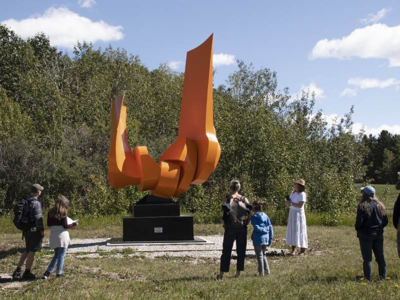 Image of tour viewing a sculpture