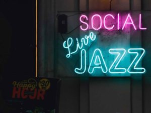 Image of neon sign that reads Social Live Jazz
