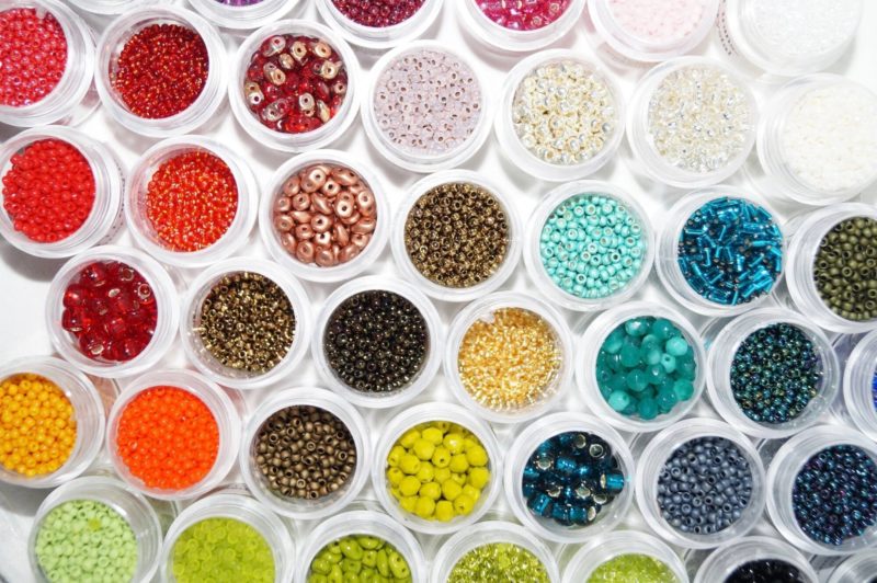 Colourful beads in containers
