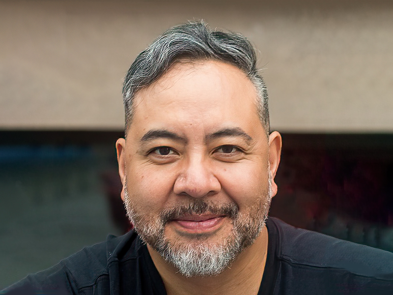 Headshot photograph of Allan Rosales