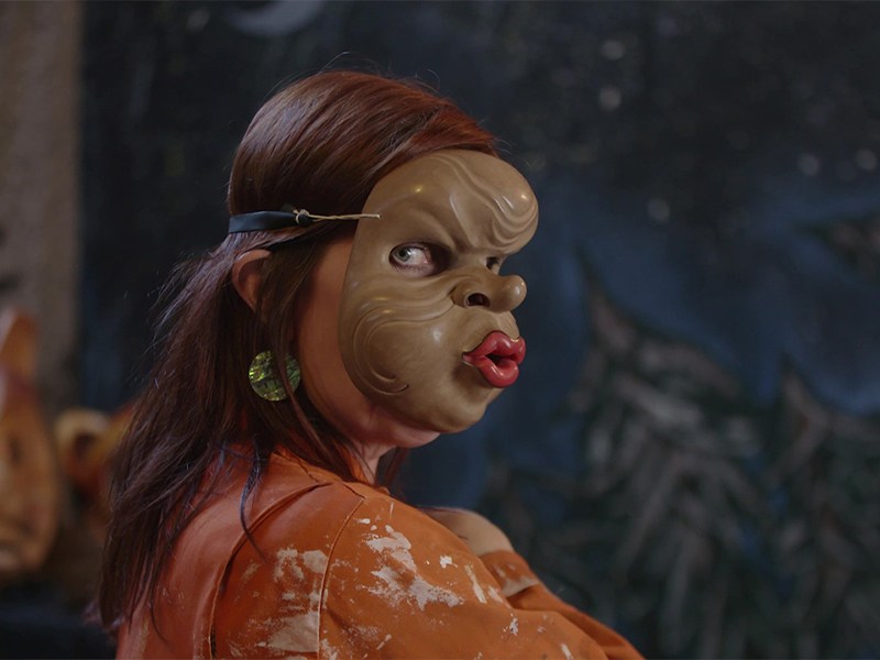 An image of a woman wearing a mask