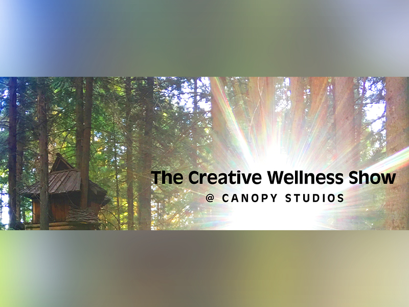 Photo of a forest canopy with a cabin | The Creative Wellness Show