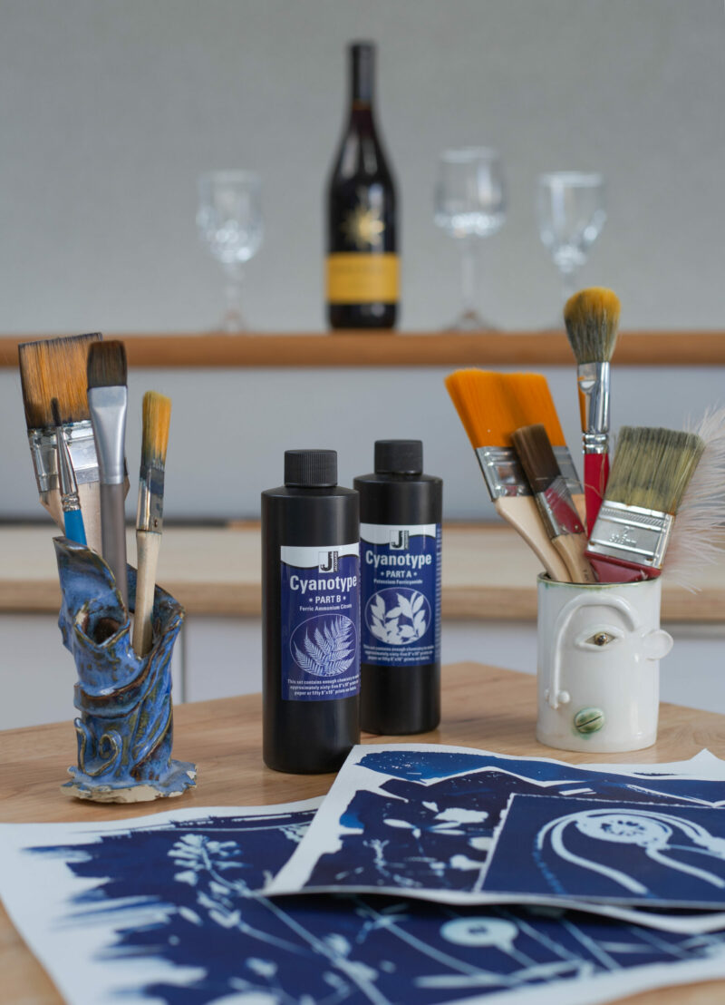 A selection of art materials and artwork produced to promote the workshop