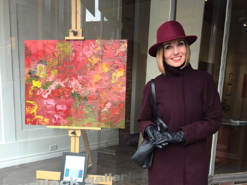 Image of Olha Bosak with her artwork
