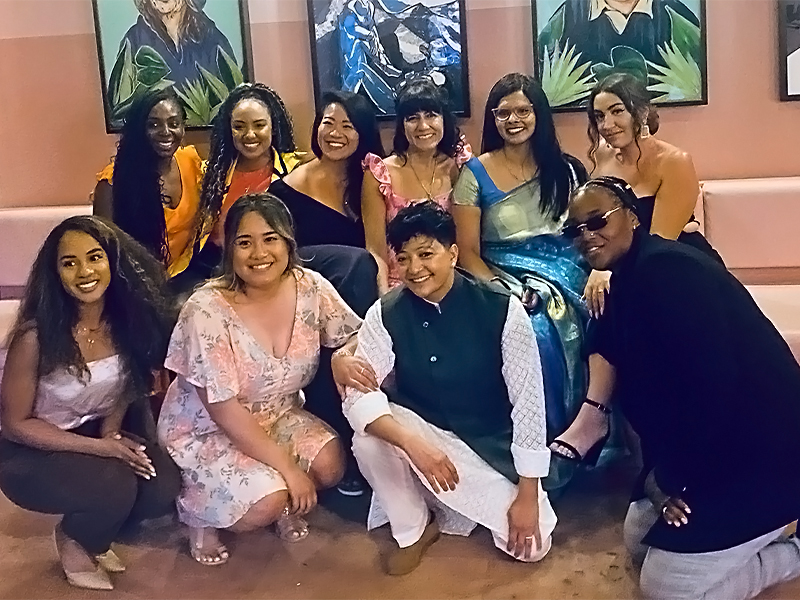 An indoor group photo of 10 people in two rows, including members of Humainologie with Fatima Dobrowolski and the SHADES cast at the film's premiere.