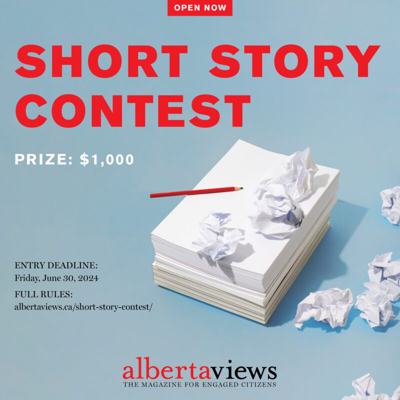 Alberta Views Magazine's short story contest promotional graphic with a stack of paper and writing implement portrayed