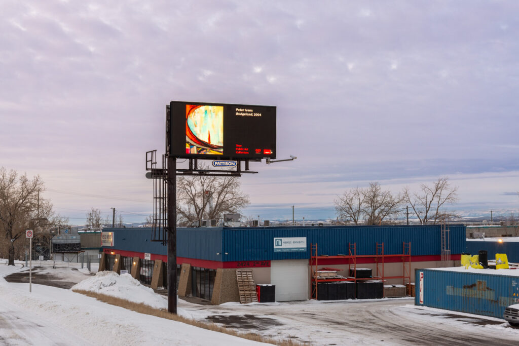 A photo of a digital billboard, showcasing artwork from Peter Ivens's representation of Bridgeland.