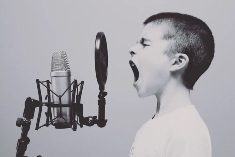 Vintage photo of a child singing into a microphone