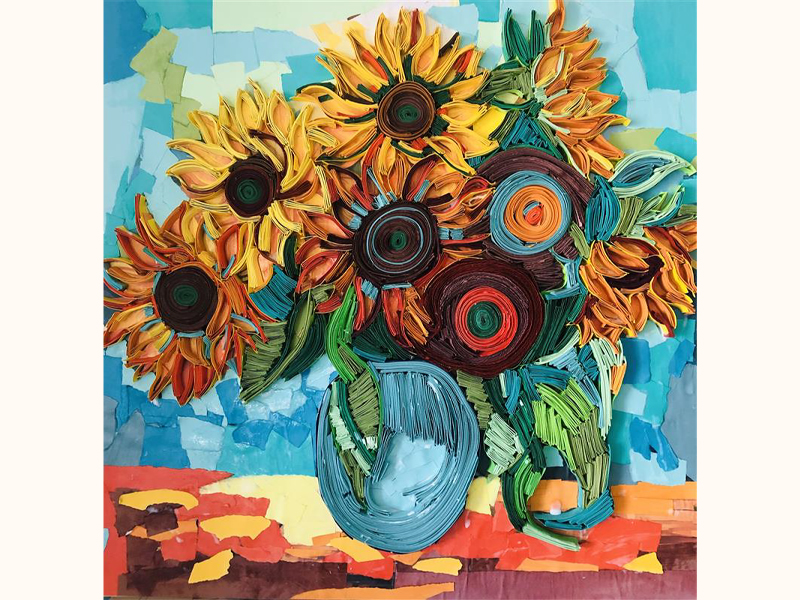 A multicolour quilling piece of a bouquet of mostly sunflowers in a vase on a table, by Karine Nazaryan