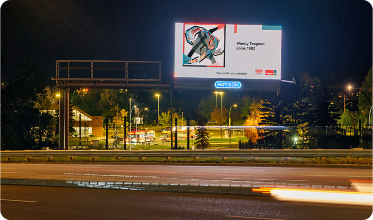 Billboard outside an LRT station at night, with artwork by Wendy Toogood - Loop