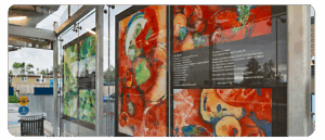 A digital reproduction of artwork by 2Peaz at a BRT station