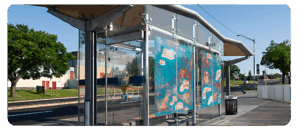 A digital reproduction of artwork by Chris Maier at a BRT station